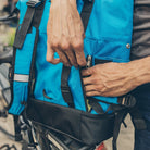 Store shoulder strap in side pockets of Mardy Backpack Pannier